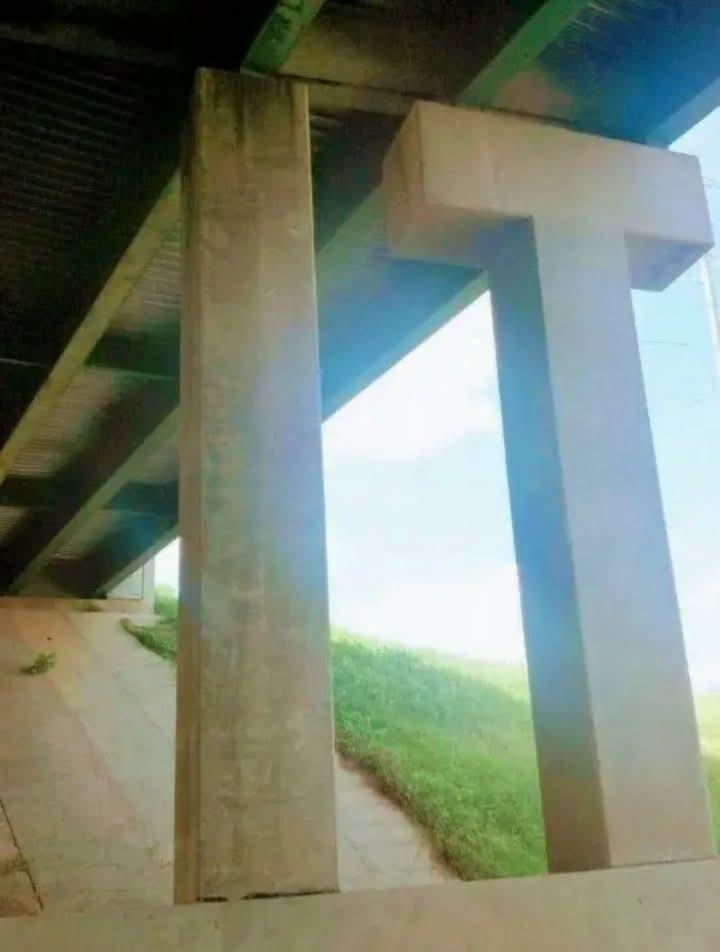 Concrete overpass supports that happen to form the letters "I" and "T."